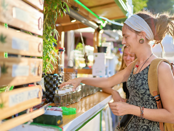Customer browsing products at a cannabis dispensary, highlighting the need for specialty insurance coverage for unique businesses.