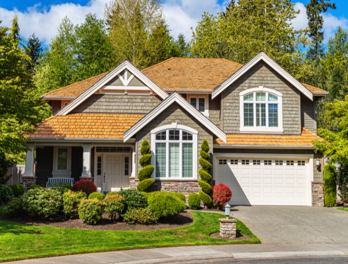 Beautiful suburban home with a well-manicured lawn, representing the security and protection provided by homeowners insurance.